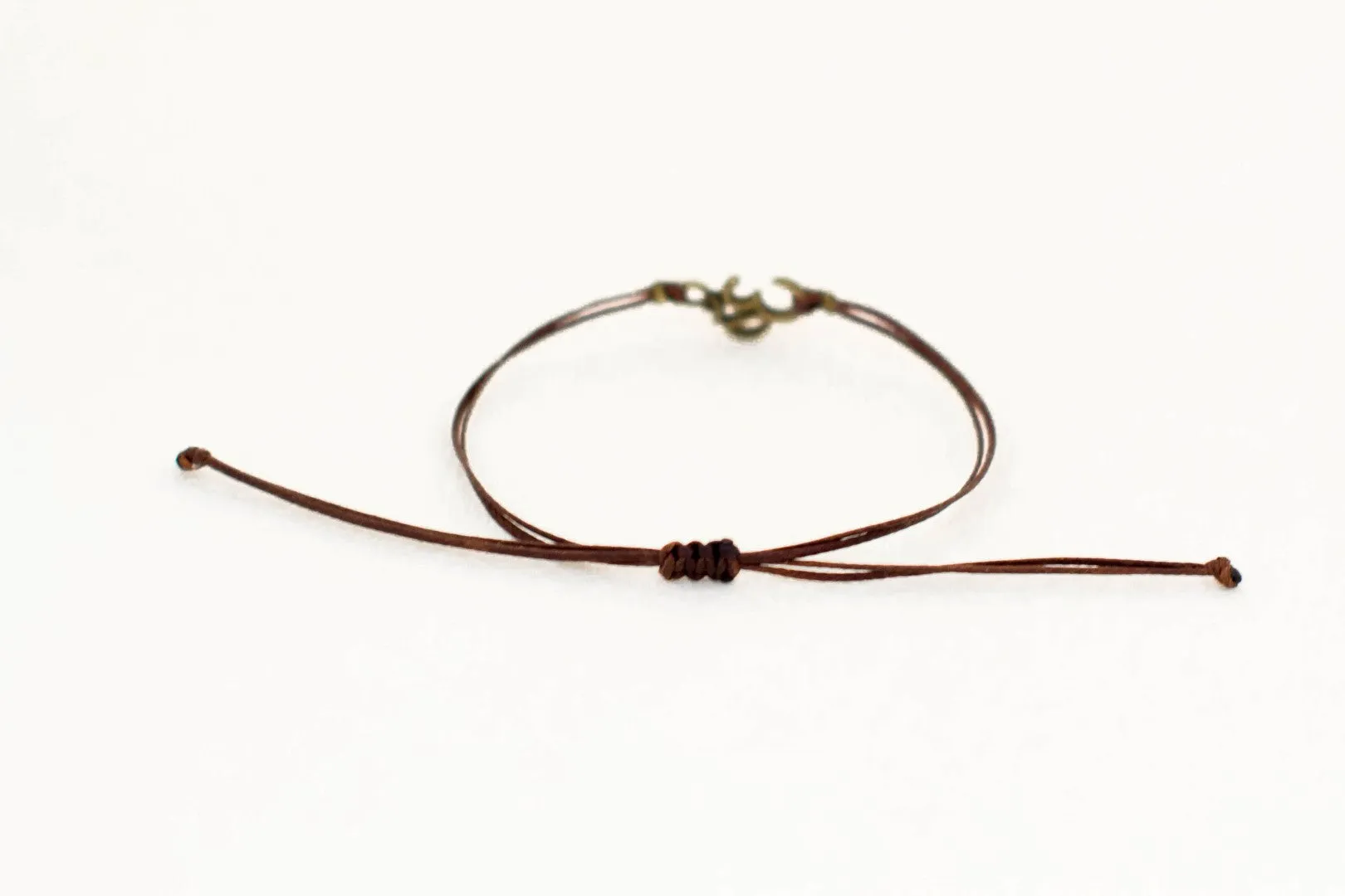 Men's bracelet with bronze Om charm, brown cord