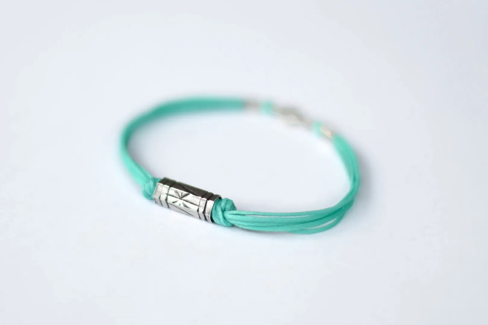 Turquoise cord bracelet for men, silver tube charm for him