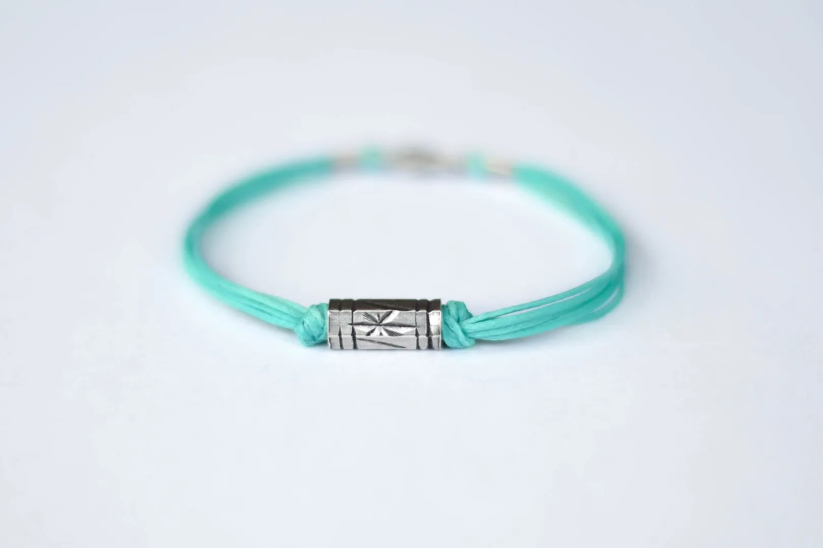 Turquoise cord bracelet for men, silver tube charm for him